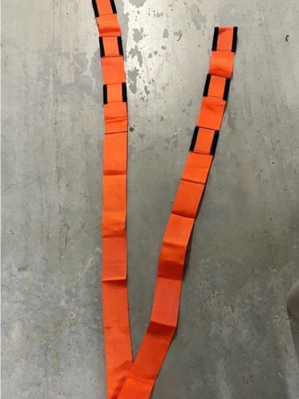 2 Orange and Black Forearm Forklift Moving Straps